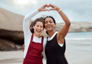 Salt water heals all wounds. Shot of two attractive young woman standing together on the beach