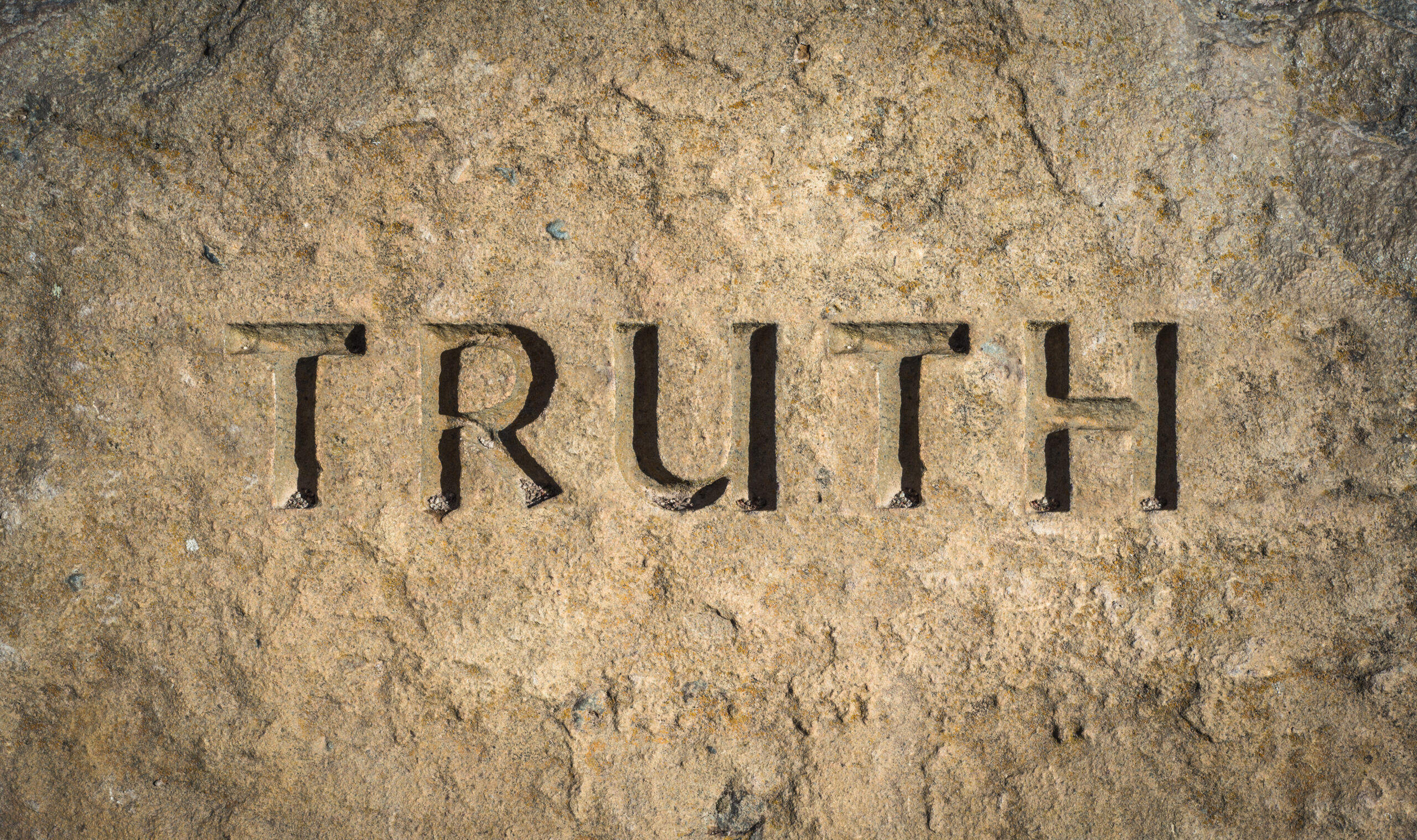 Conceptual Image Of The Word Truth Chiselled Into Stone Or Rock